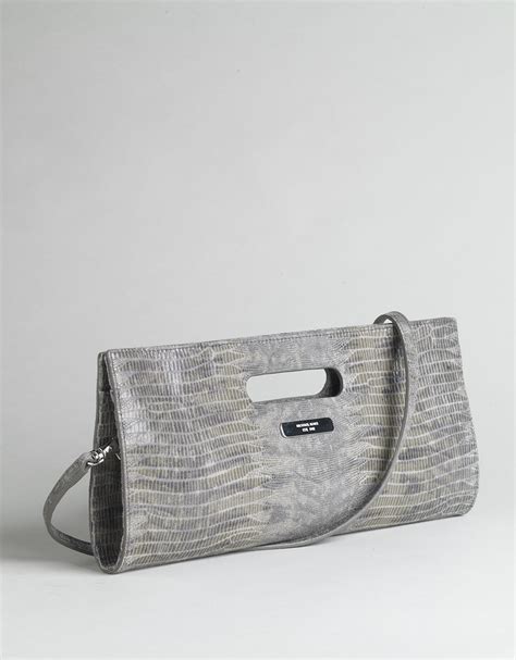 does michael kors use fake snake skin klutch|are michael kors bags real.